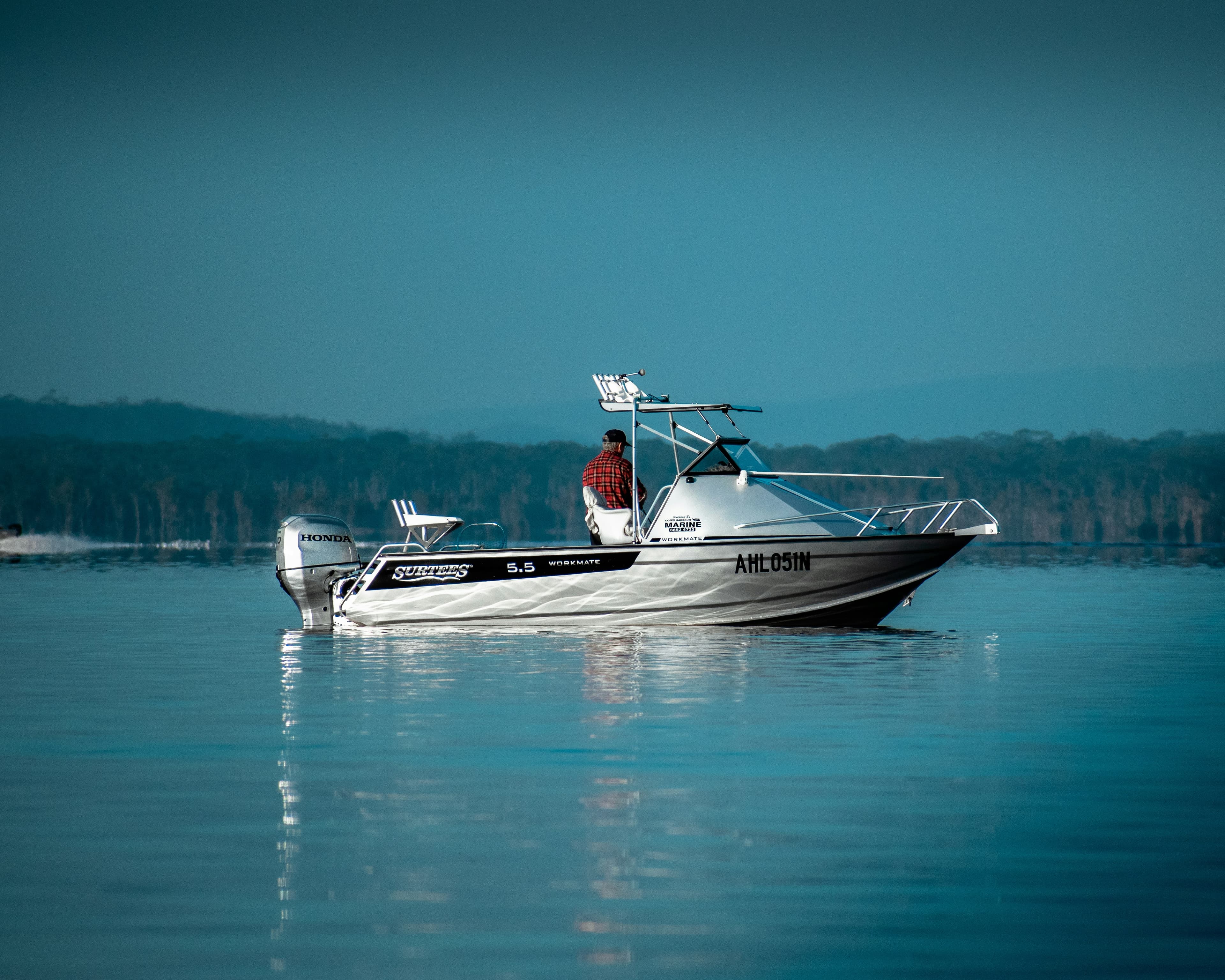 Honda outboard on a fishing boat at dawn